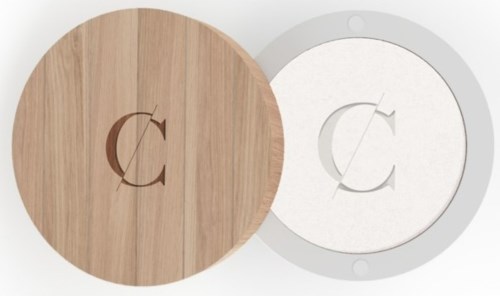 A wooden round object and a white round object with a similar logo, possibly a clock or a decorative piece.