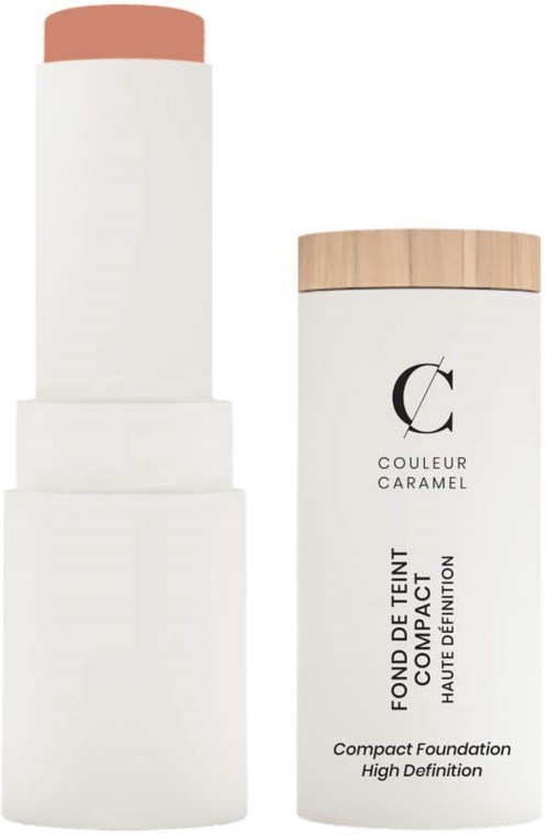 En vit foundation-sticka med beige lock, och en matchande vit behållare med ett trälock för flytande foundation.