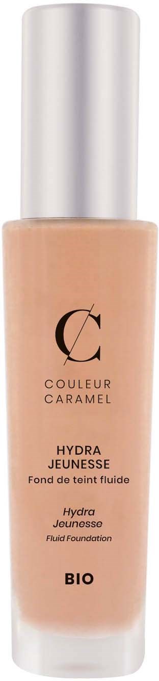 En flaska med silverlock, beige flytande foundation, märkt 'Couleur Caramel Hydra Jeunesse'.
