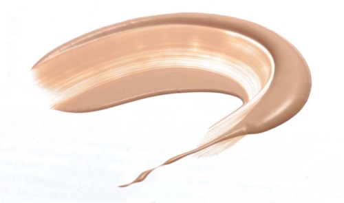 En beige eller foundationsmakering på vit bakgrund.