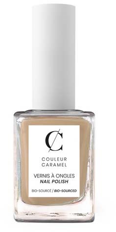 A white cylindrical bottle with clear nail polish inside and a black and white label on the front.