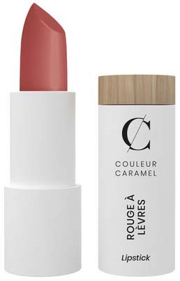 A lipstick in a white cylindrical holder with a wooden cap, labeled "COULEUR CARAMEL" and "Rouge à Lèvres."