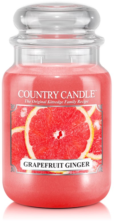 Rosa ljusmärke med texten 'Grapefruit Ginger' och bilder av grapefruktskivor på etiketten.