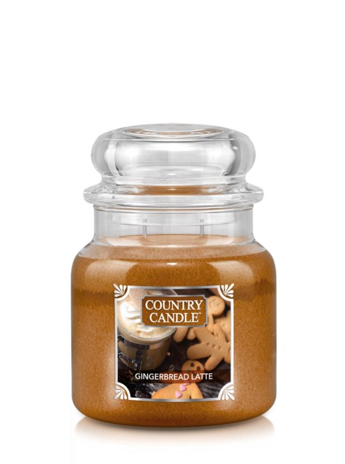 En liten glasburk med lock, märkt 'Country Candle Gingerbread Latte', som innehåller brunt vax.