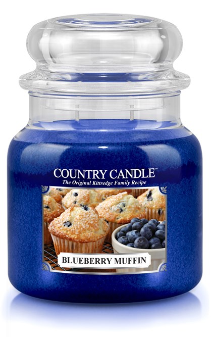Blåbärsmuffins doftljus i glasburk med etikett som visar muffins och blåbär.