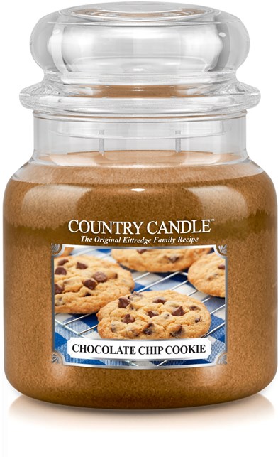 Stort ljus i ett glas som ser ut som en chocolate chip cookie. Det har en bild av kakor på etiketten.
