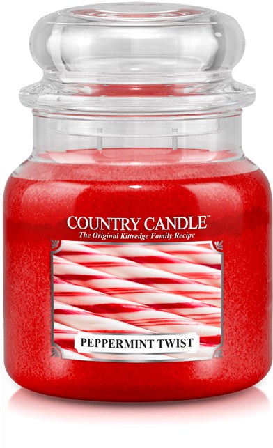 En röd doftljus i en tydlig glasburk med lock, märkt 'Country Candle' och 'Peppermint Twist'.