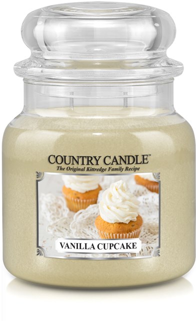 Snäckfärgad ljuslykta med illustration av vaniljmuffin och label för Country Candle i glasburk.