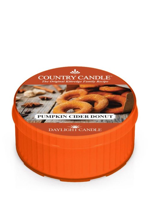 Rund orange lys med billede af pumpkin cider donuts og tekst om en familietradition.