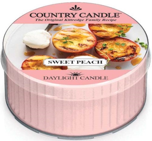 En rund rosa ljuslåda med bilder av persikofläckade godsaker och en etikett som säger "Sweet Peach".