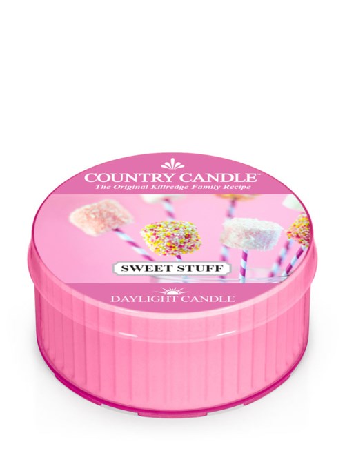 Rund rosa förpackning med ljus formade som marshmallows på pinnar, dekorerade med färgglada strössel och socker.