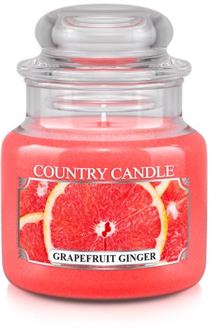 En doftljus märkt 'Country Candle' med grapefrukt och ingefära, i en klar glasburk med lock.