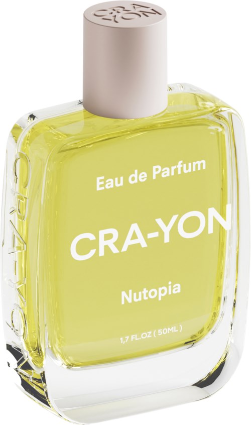 Butelka perfum z żółtą cieczą, różową nakrętką i białym tekstem: 'Eau de Parfum CRAYON Nutopia'.