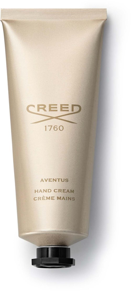 En beige handkrämstube med svart lock, märkt 'Creed 1760 Aventus Hand Cream'.