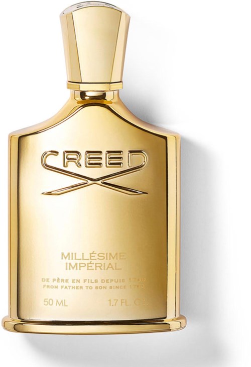 Guldfärgad parfyllåda med orden 'CREED' och 'Millésime Impérial' på etiketten.