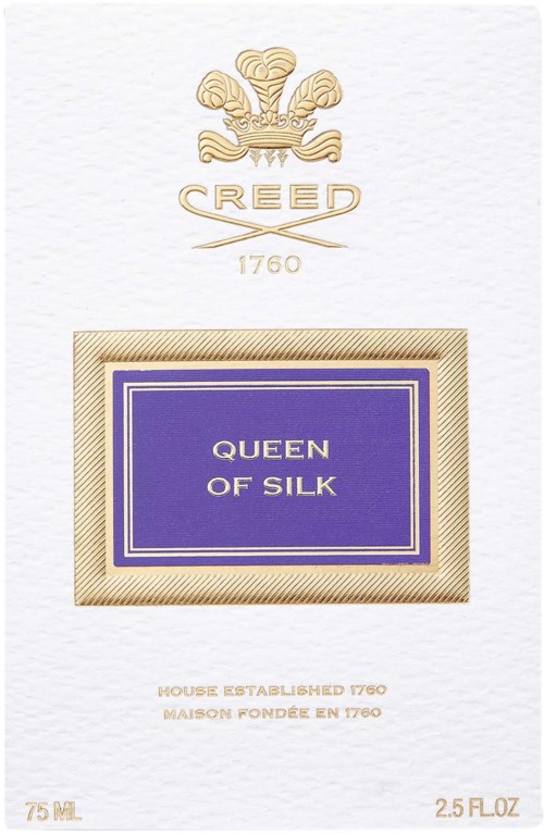 En parfymförpackning märkt 'Queen of Silk' med en gyllene vapen och en lila etikett.