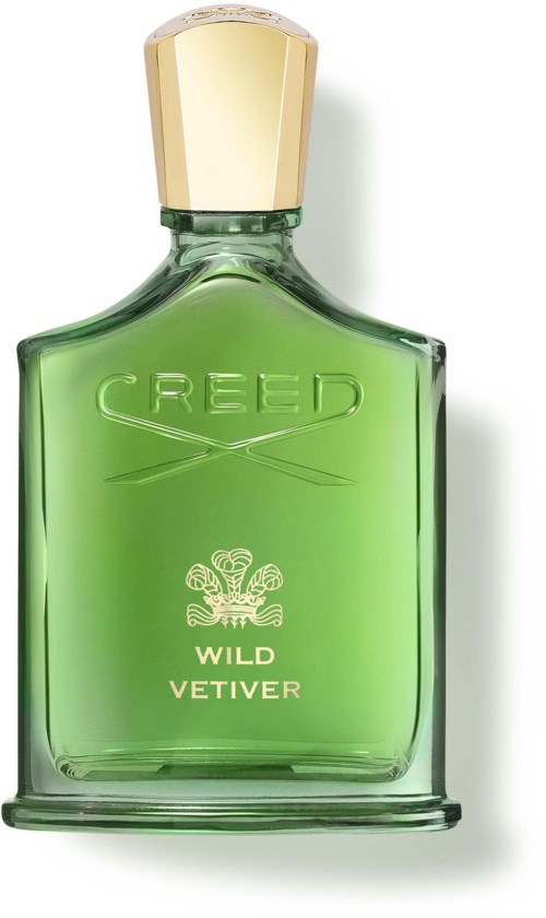 En grön parf bottle med en guldkapsel och texten Creed Wild Vetiver.