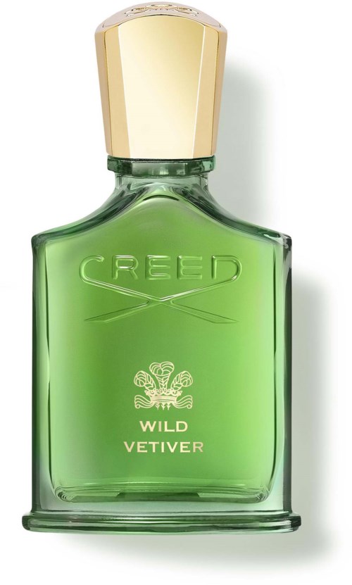 En grön parfymflaska med guldig topp, märkt Creed Wild Vetiver, med en dekorativ emblem och text.