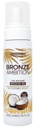 En vit flaska med pump innehåller en bruningsmousse, märkt 'Creightons Bronze Ambition'. Den har en kokosbild.