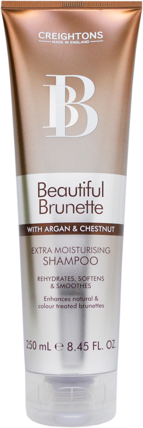 En flaske med sjampo merket 'Beautiful Brunette' med argan og kastanj, for fuktighet og mykgjøring av hår.