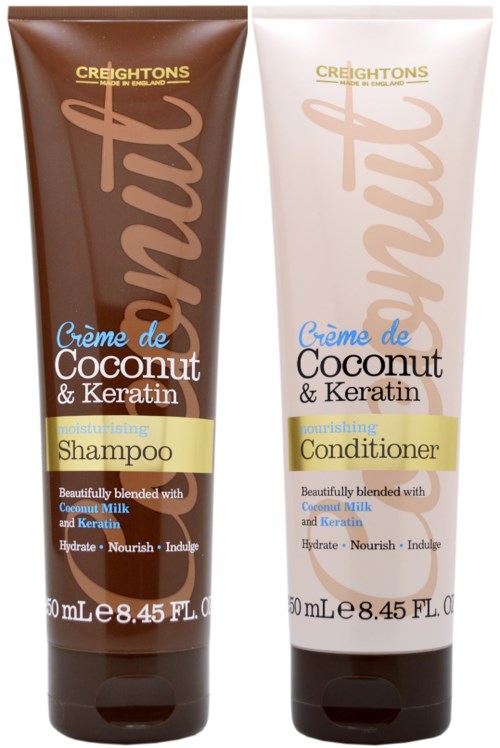 Två hårvårdsprodukter, schampo och balsam, med kokos och keratin, i bruna och vita tuber.