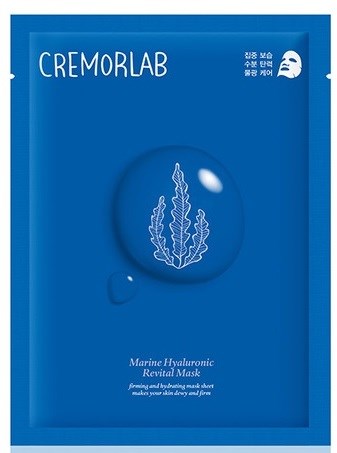 En blå förpackning med vitt text och en bladillustration. Den har en masklogo och produktnamn, 'CREMORLAB'.