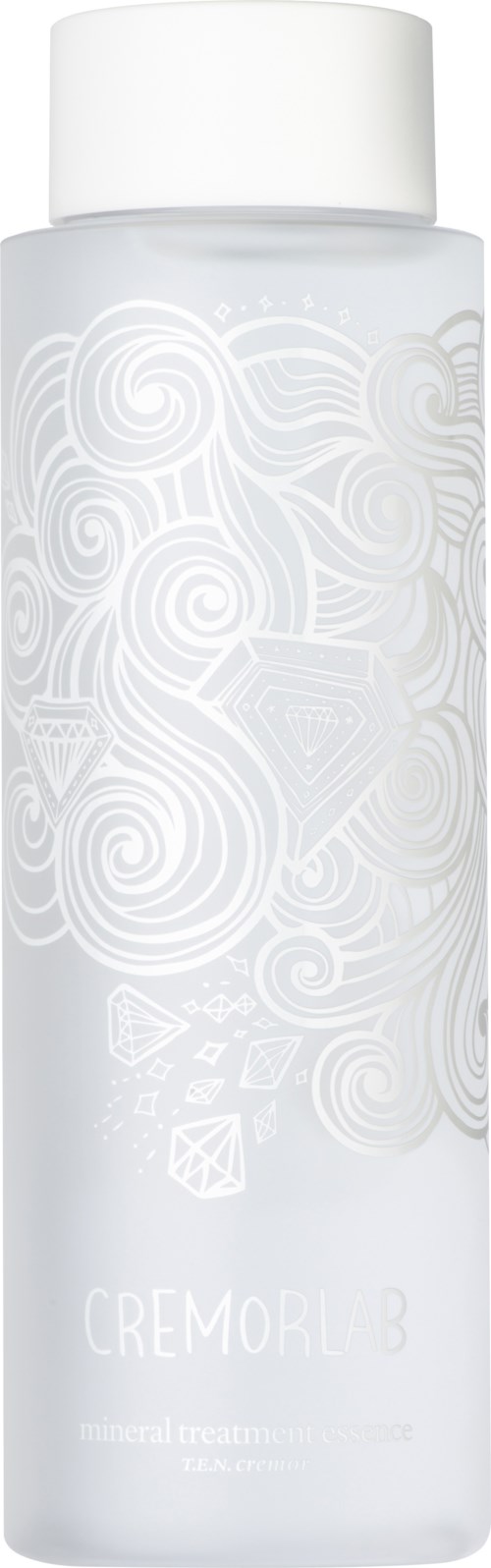 En lång vit flaska med vit kork, vit mönster med swirl-design och text som säger "CREMOBL 8."