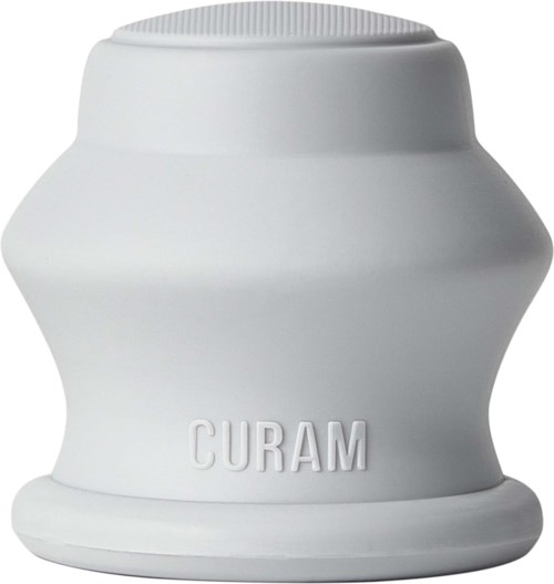 A white, rounded container with the word 'CURAM' embossed on it. The shape is smooth and slightly wider in the middle.