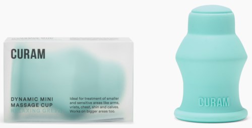 En liten blå massagekopp och dess box, används för hudterapi, med enkel text och en enkel bakgrund.