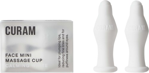 Pakke til mini massagekopper og en lille æske mærket 'CALMING' til øjenbrug, designet til ansigtsmassaget.