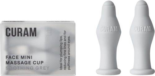 En æske mærket 'QUARAN Face Mini Massage Cup' med to hvide massagekopper ved siden.