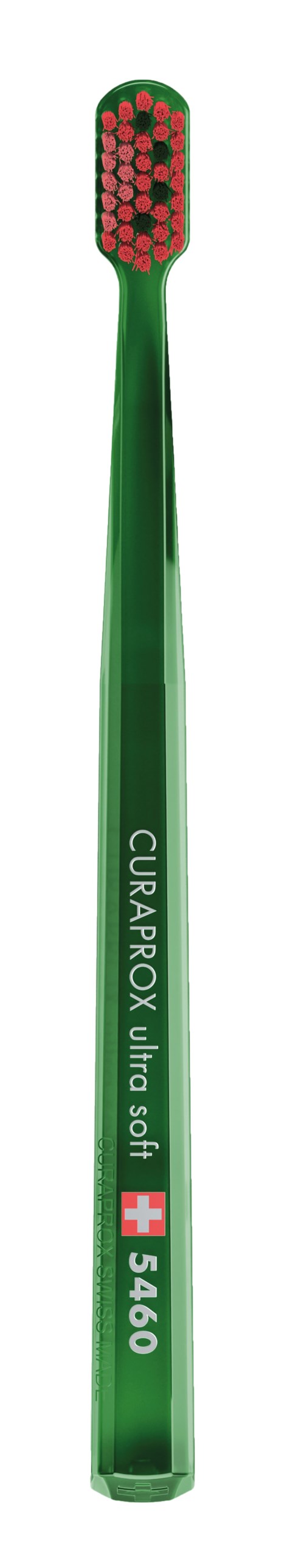 En grøn tandbørste med røde og hvide børster, mærket 'CURAQROX ultra soft 5460'.