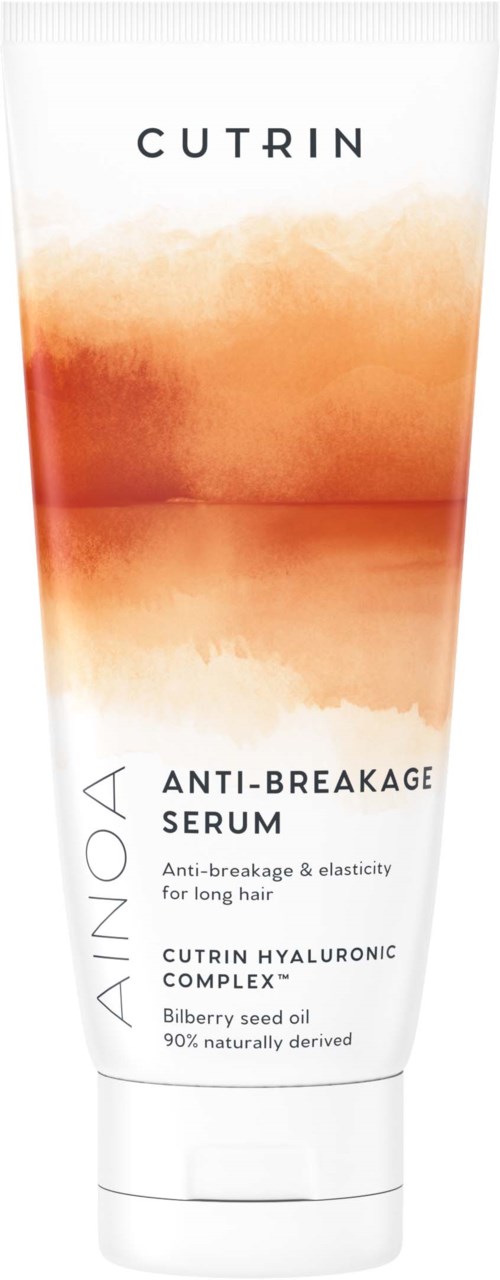 En hvid tube med orange vandfarge design, mærket 'CUTRIN ANTI-BREAKAGE SERUM' til hårpleje, indeholder hyaluronsyre og seed oil.