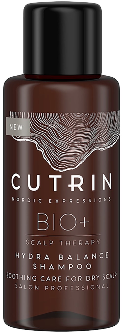 En brun flaska märkt 'Cutrin Bio+ Scalp Therapy Shower Shampoo' för torr hårbotten, med svart lock.