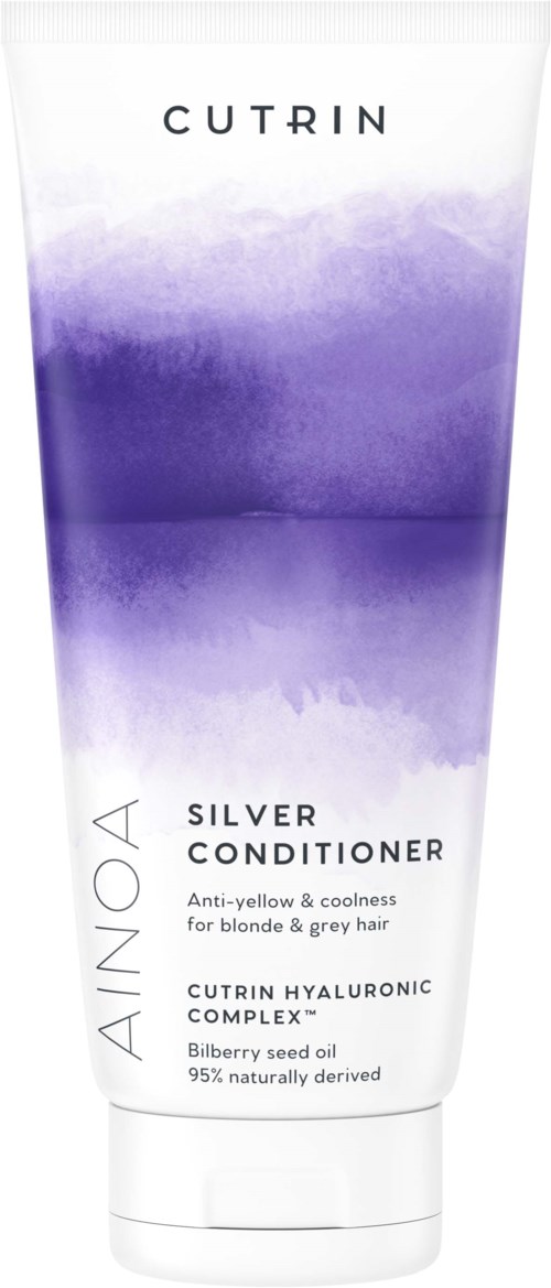A tube of gold-colored conditioner with purple design, containing ingredients like blueberry seed oil and hyaluronic complex.
