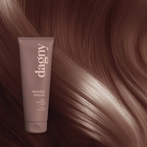 A tube of Dagy Frosted Mocha hair color cream next to shiny, smooth brown hair.