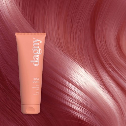 A pink tube of hair care product called daarry is placed on a shiny pink and white swirled background.