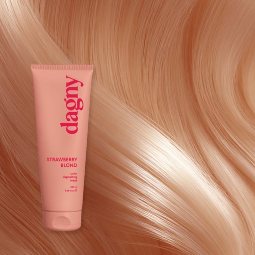 A pink hair coloring mask tube on a shiny, wavy blonde hair background.