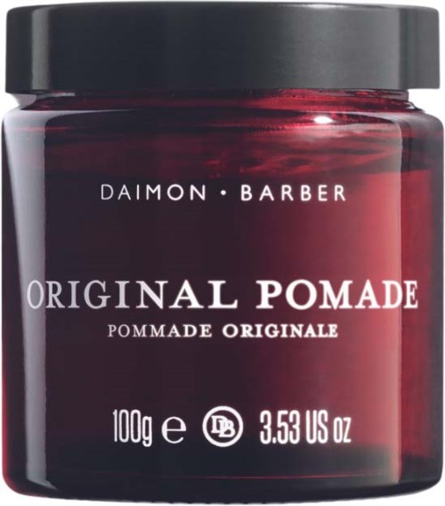 Dunkelroter Behälter mit schwarzem Deckel, beschriftet 'Original Pomade' von Daimon Barber, enthält 100g.