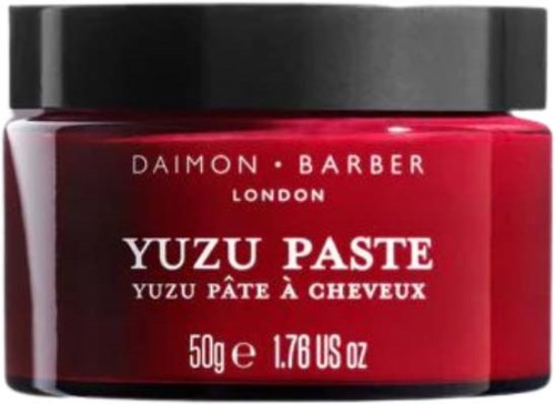 A red jar of Yuzu Paste for hair, labeled from Daimon Barber London, 50g.