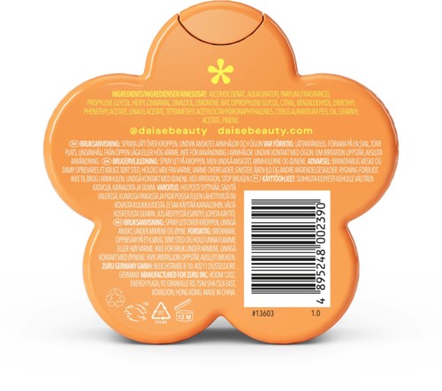 En rund orange beholder med en gul blomsterlignende form, der viser ingredienser, stregkode og webadresse.