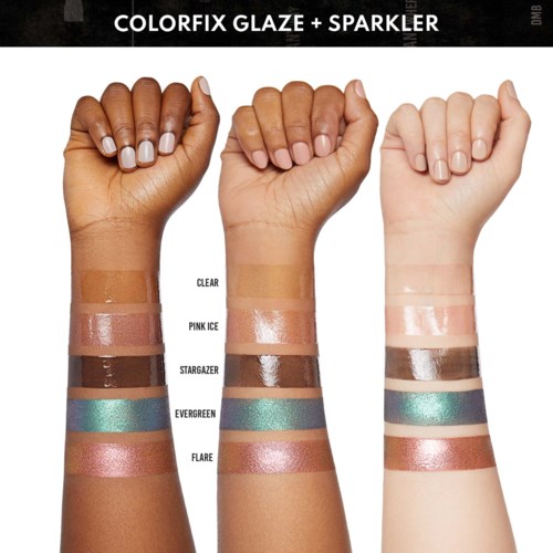 Three arms showing different skin tones and eye shadow shades on swatches. They are raised with fists partly clenched.