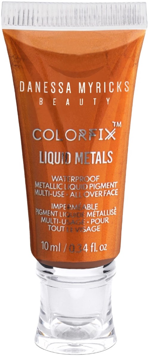 Pomarańczowa tubka z białą zakrętką, etykieta czyta 'Danessa Myricks Beauty Color Fix Liquid Metals,' 10 ml.