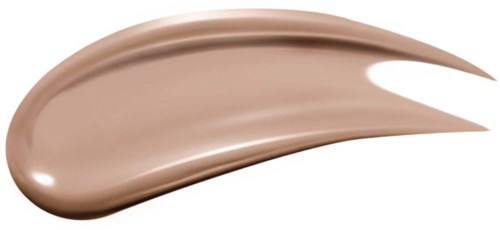 En brun makeupgrund eller concealer-smältning med en slät, krämig textur, avsmalnande i ena änden.