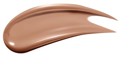Ett streck av ljusbrun makeup eller foundation med en slät, glänsande yta på en svart bakgrund.