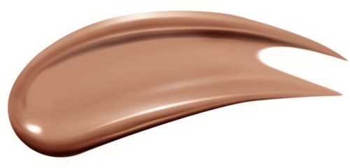 En slät, glänsande, beigefärgad kosmetikaprodukt som är utstrykning med en spetsig kant.