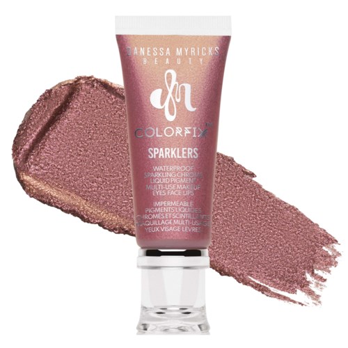 A tube of Danessa Myricks Beauty Color Fix Sparklers with pinkish glittery texture behind it.