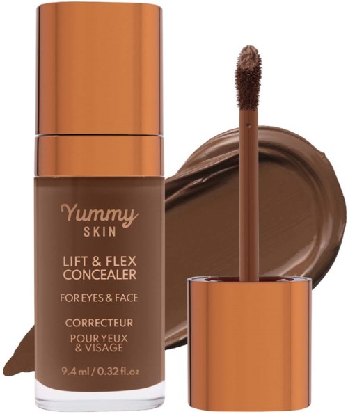 Yummy Skin peiteainepullo ja sienen käyttäminen, ympärillä ruskea peitevoide näytteenä.