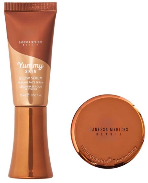 Två hudvårdsprodukter: en tub märkt 'Yummy Skin' och en rund behållare med 'Danessa Myricks' på.