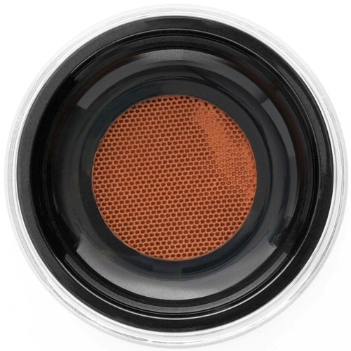Close-up van een ronde oranje make-up spons met een getextureerd oppervlak voor hetblenden van make-up.
